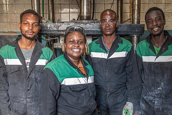 Nzambi, second left, with her colleagues in the factory.jpg